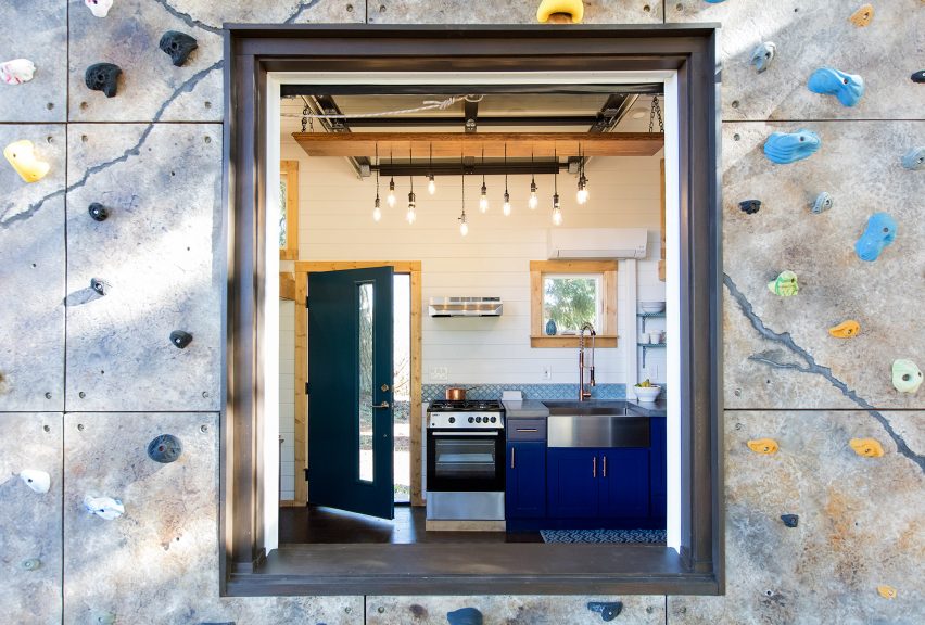 Cabin with climbing wall by Tiny Heirloom