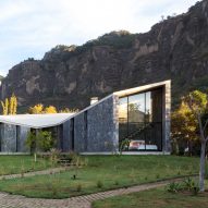 Stone and concrete retreat stands at the foot of Mexican mountain range