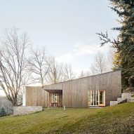 Marc Mogas slots prefab summer home into wooded slope in the Pyrenees