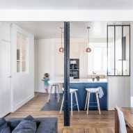 Anne-Laure Dubois uses dark blue tiles and poplar plywood to update Paris apartment