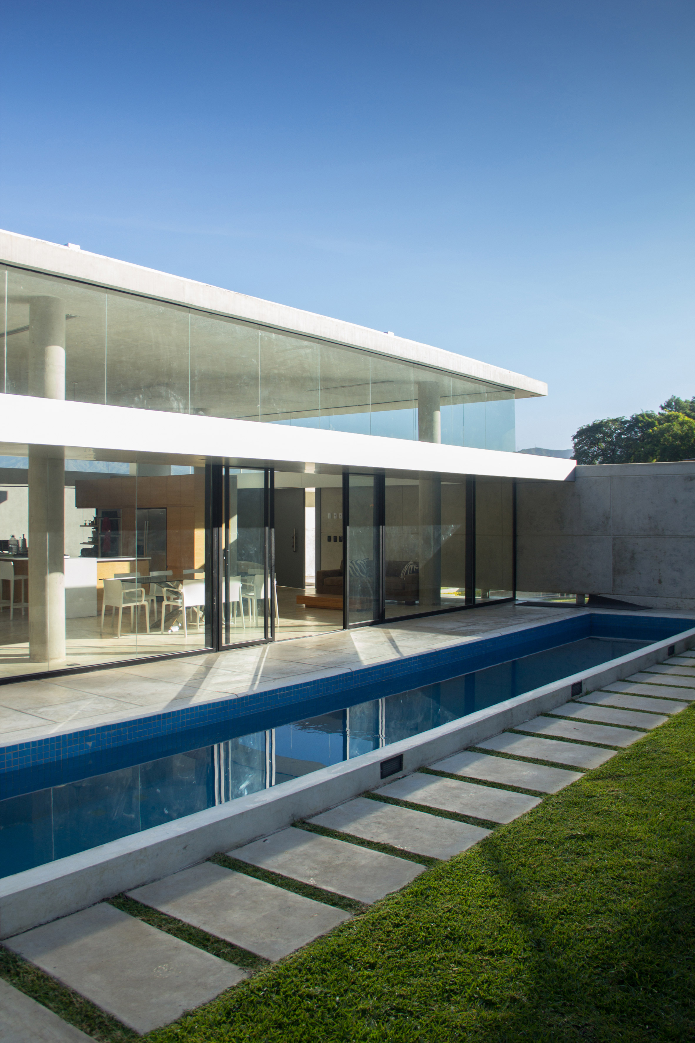 NMD Nomadas' concrete and glass house in Venezuela features skinny swimming pool