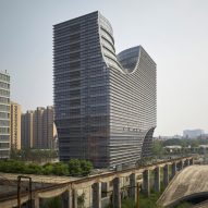 Arched chasms extend through Hangzhou office block by Julien De Smedt