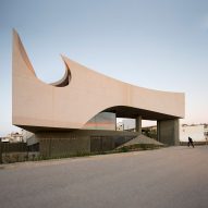 Huge circular hole pierces concrete house in Crete by Tense Architecture Network