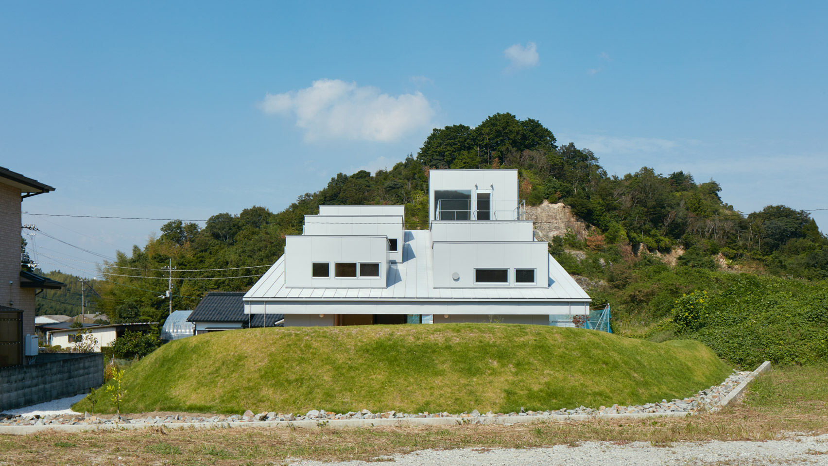 Dormer Windows Protrude From Mono Pitched Roof Of House In Tokushima