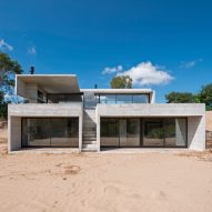 Luciano Kruk staggers board-marked concrete holiday home across sandy dune