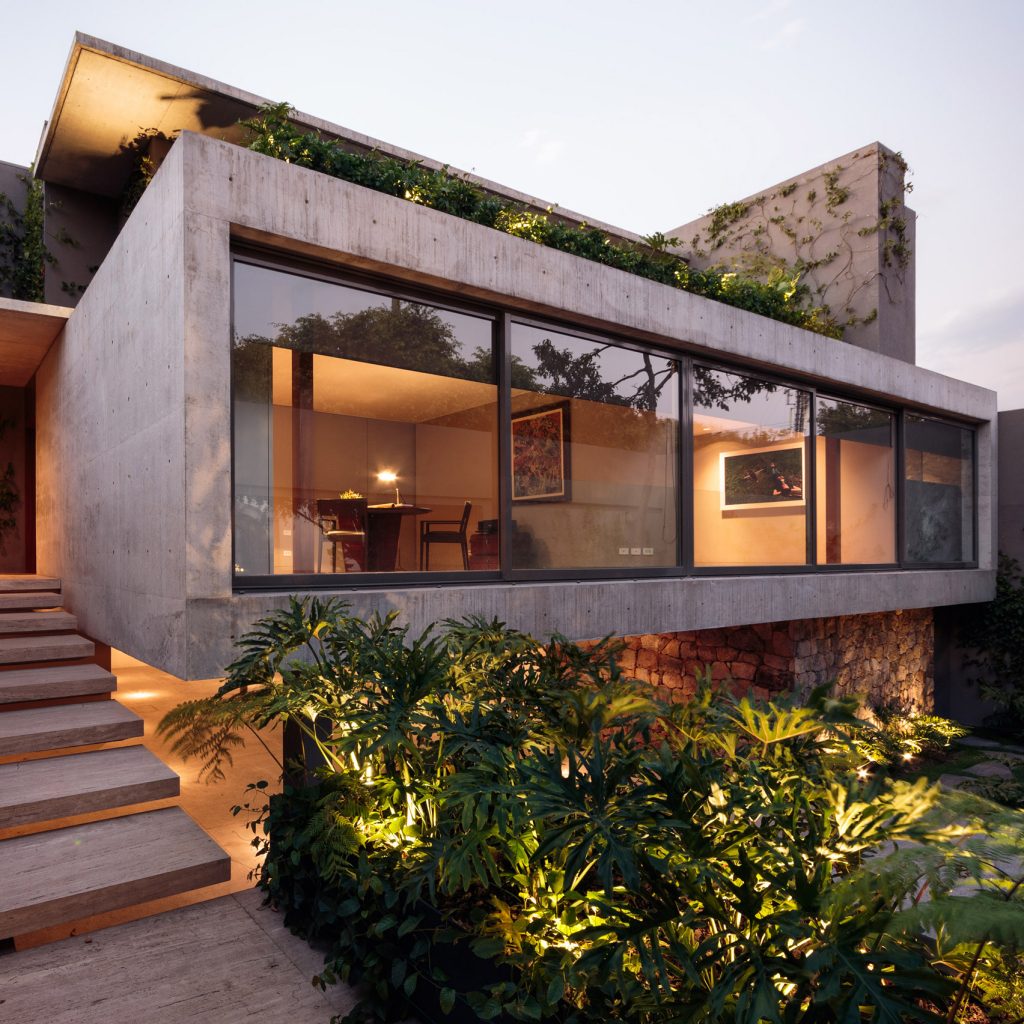 Mexico City house by JJRR/Arquitectura features sliding glass walls and  verdant terraces