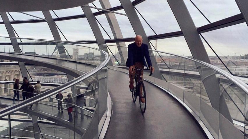 Norman Foster cycling around the Reichstag dome