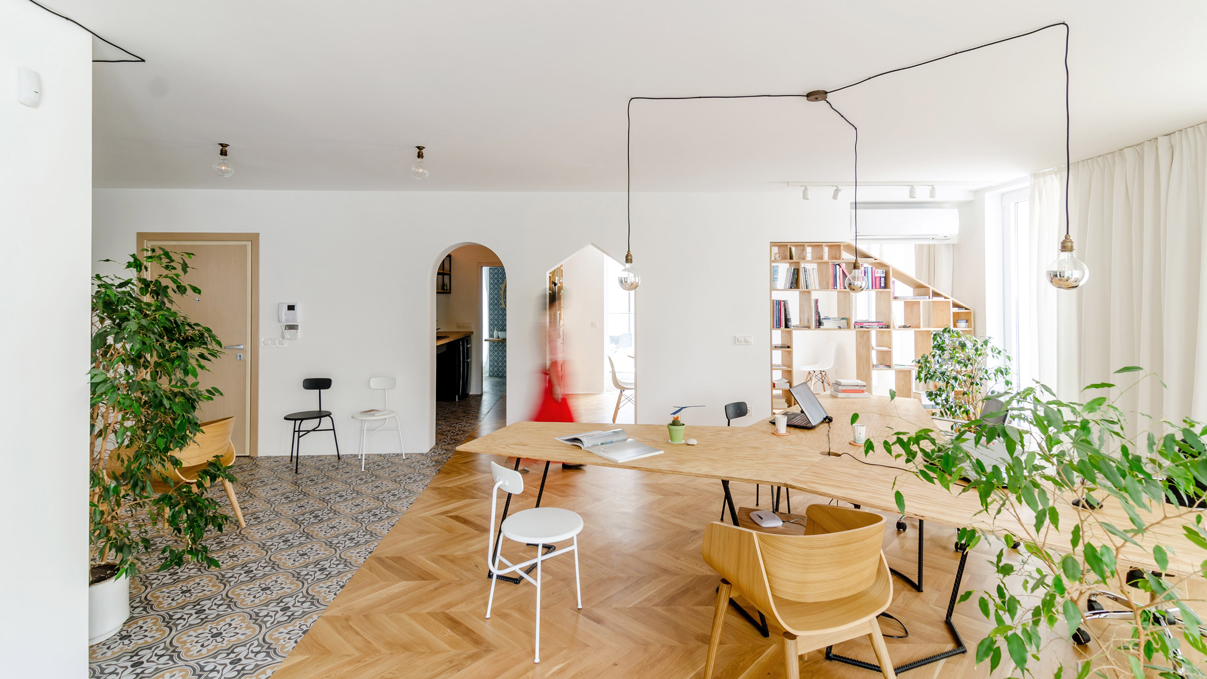 Another Studio replaces walls with storage to transform apartment into own  workspace