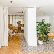 Another Studio replaces walls with storage to transform apartment into own workspace