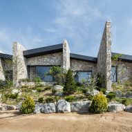 OBBA designs stone-walled holiday bungalow in rural Seoul for an elderly couple