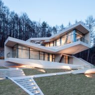 Concrete volumes cantilever and twist to provide mountain views from South Korean holiday resort
