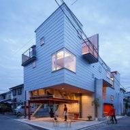 Balconies and courtyards puncture Japanese apartment building by Eureka and Maru Architecture