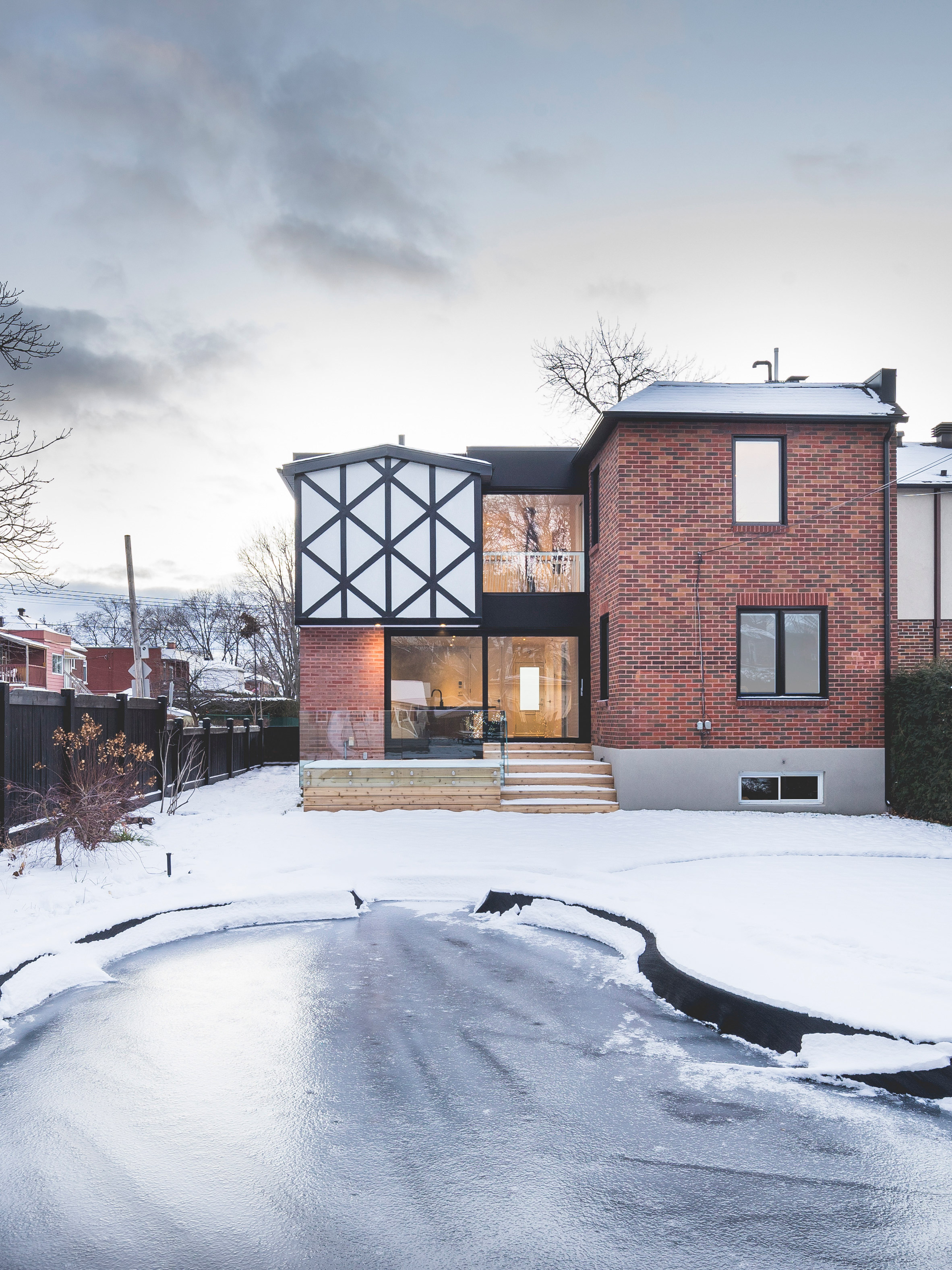 L McComber Architects gives contemporary update to Tudor-style home in Montreal