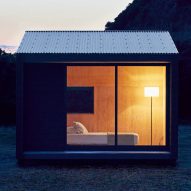 Muji to sell tiny blackened timber prefab huts for £21,000