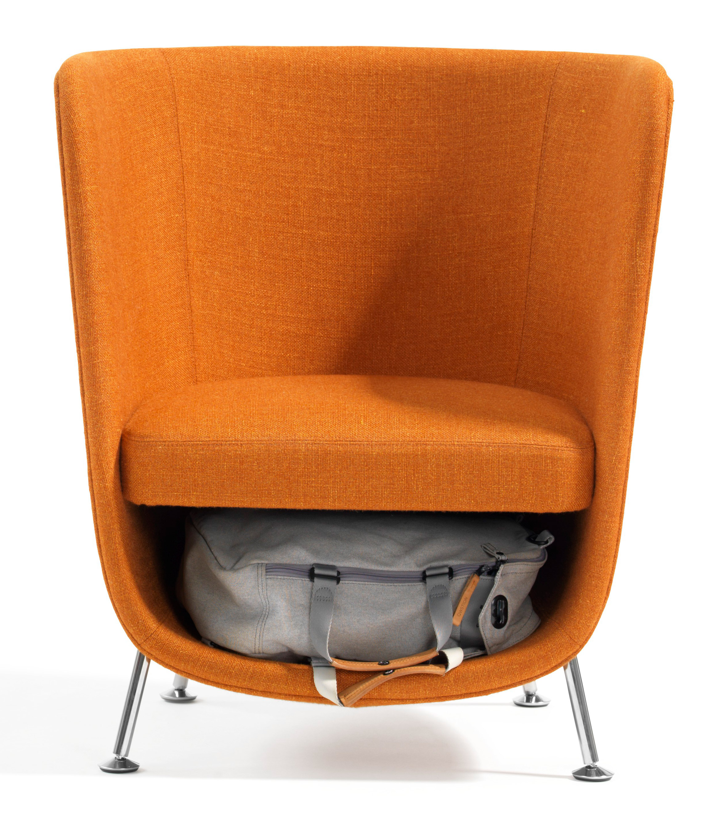 blå station's pocket armchair has extra inbuilt storage for