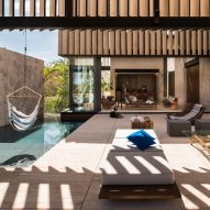 Slatted marble walls shade Casa Chaaltun pool deck in Mexico
