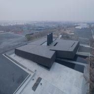 Sloping black volumes penetrate public square at Harbin's Exhibition Hall of Crime Evidences