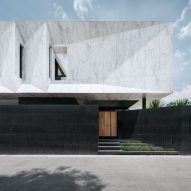 Openbox Architects tops Bangkok house with "monolithic piece of marble sculpture"
