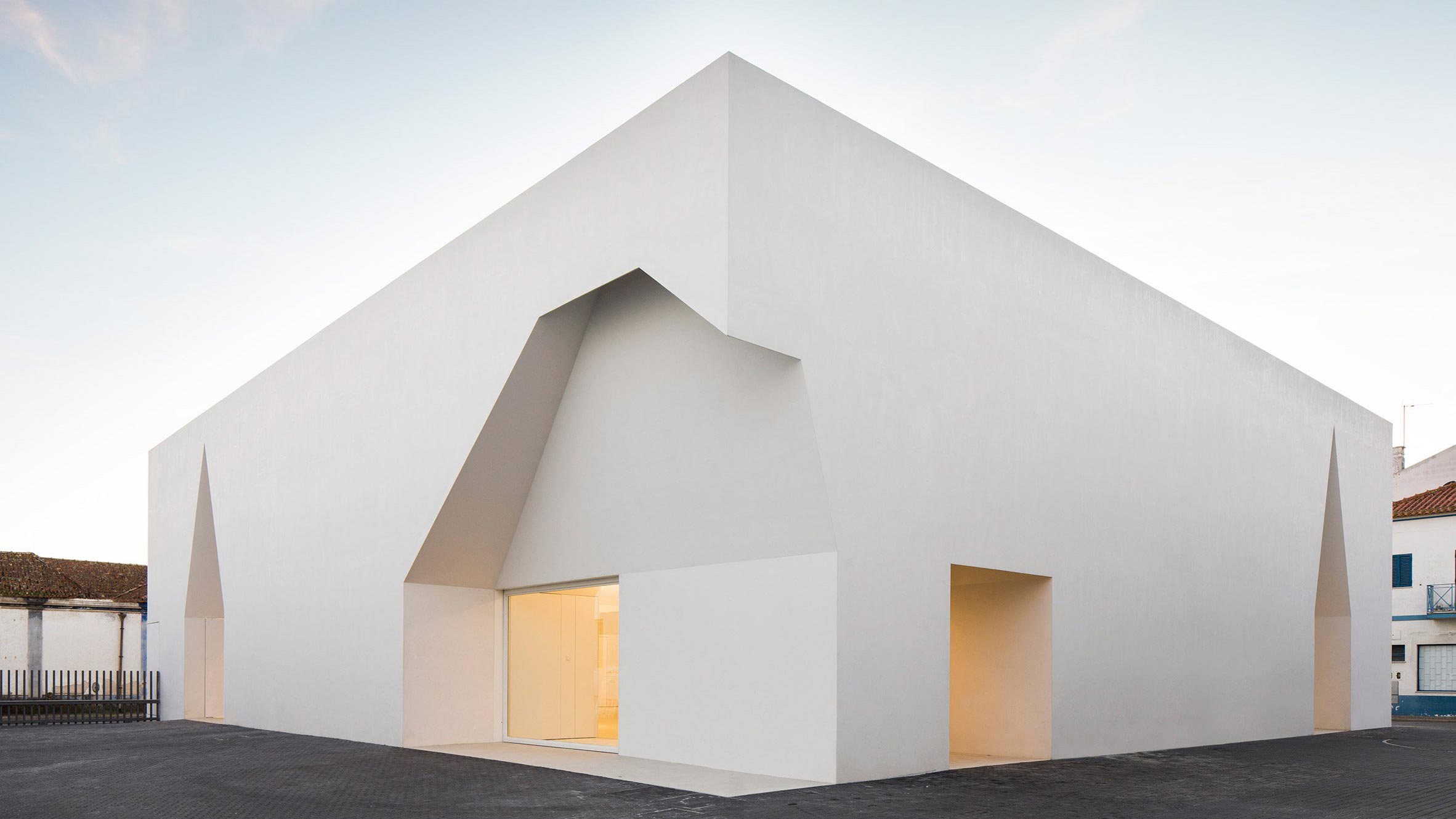 Irregular cutouts mark entrances to Aires Mateus' community centre in  Portugal