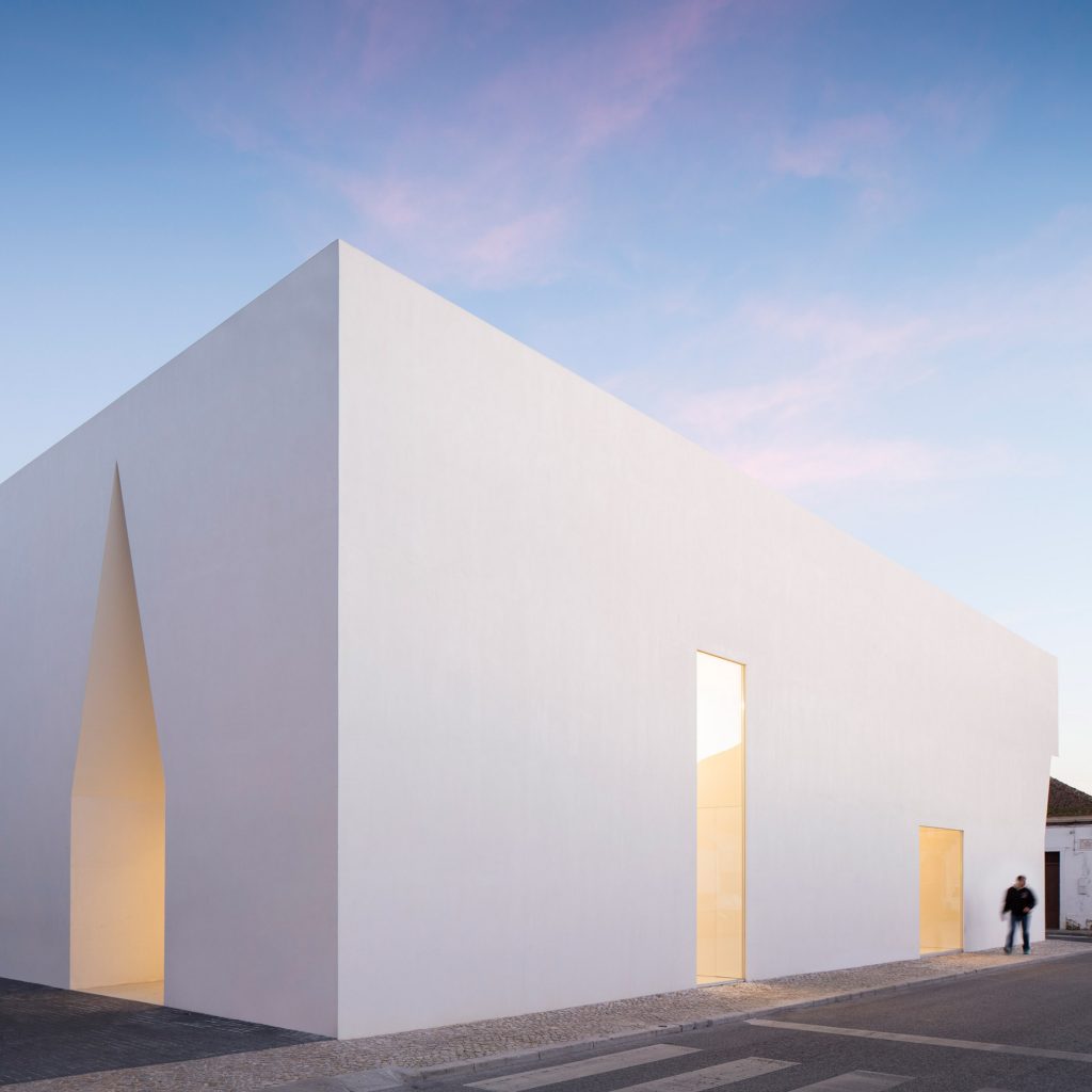 Irregular cutouts mark entrances to Aires Mateus' community centre in  Portugal