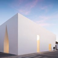Irregular cutouts mark recessed entrances to Aires Mateus' community centre in Portugal