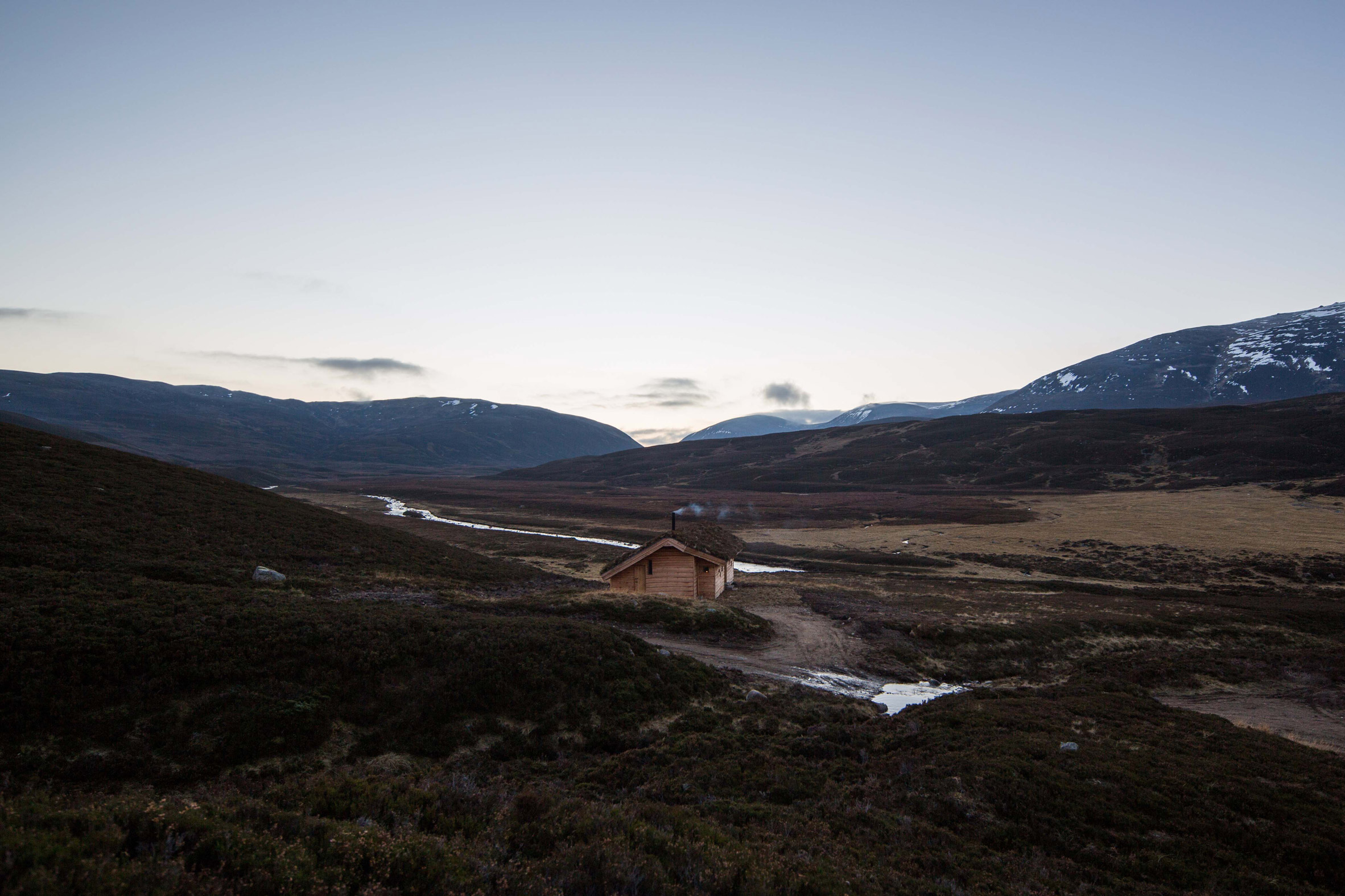 Moxon Architects builds humble cabin in mountainous Scottish landscape