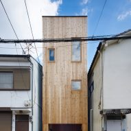 Skylights and slatted floors bring daylight into 2.5-metre-wide house in Japan