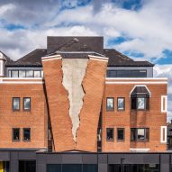 Alex Chinneck creates giant rip in the brick facade of a London building