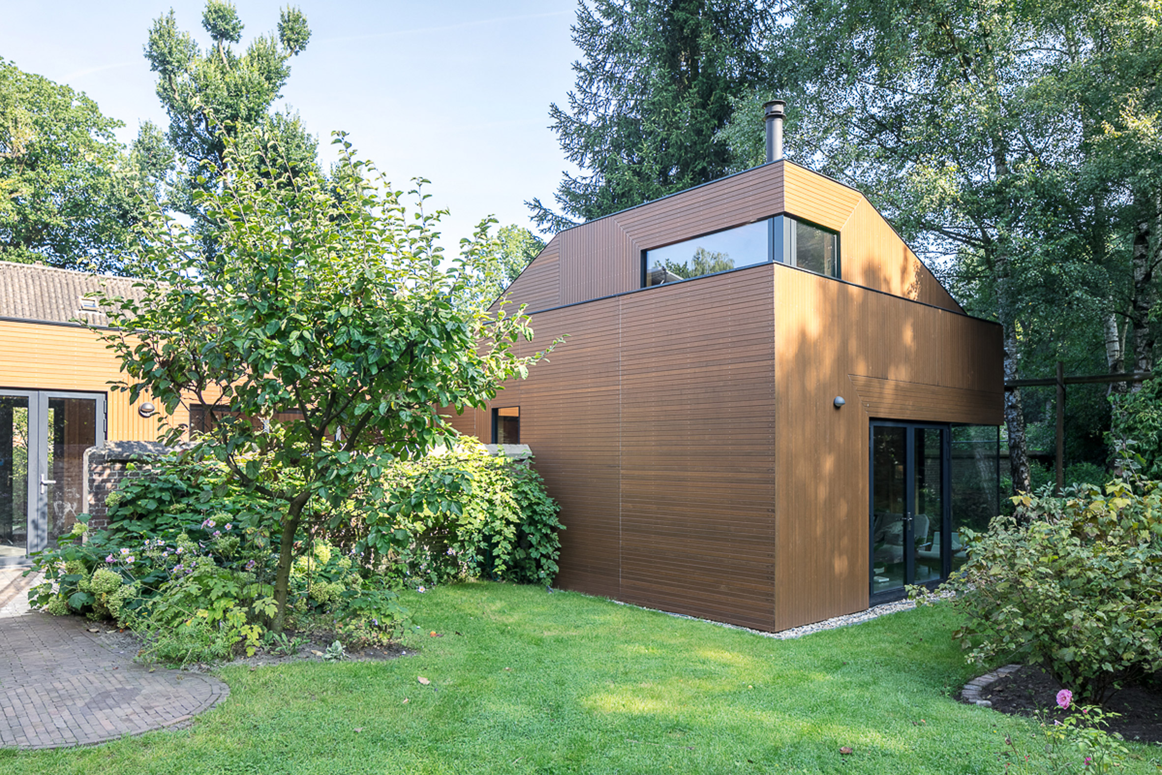 An ancient monastery wall slices through this Utrecht house extension
