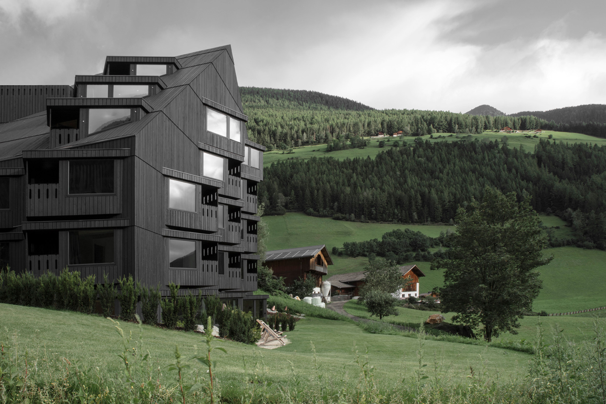 Pedevilla Architects adds angular blackened-larch extension to hotel in South Tyrol