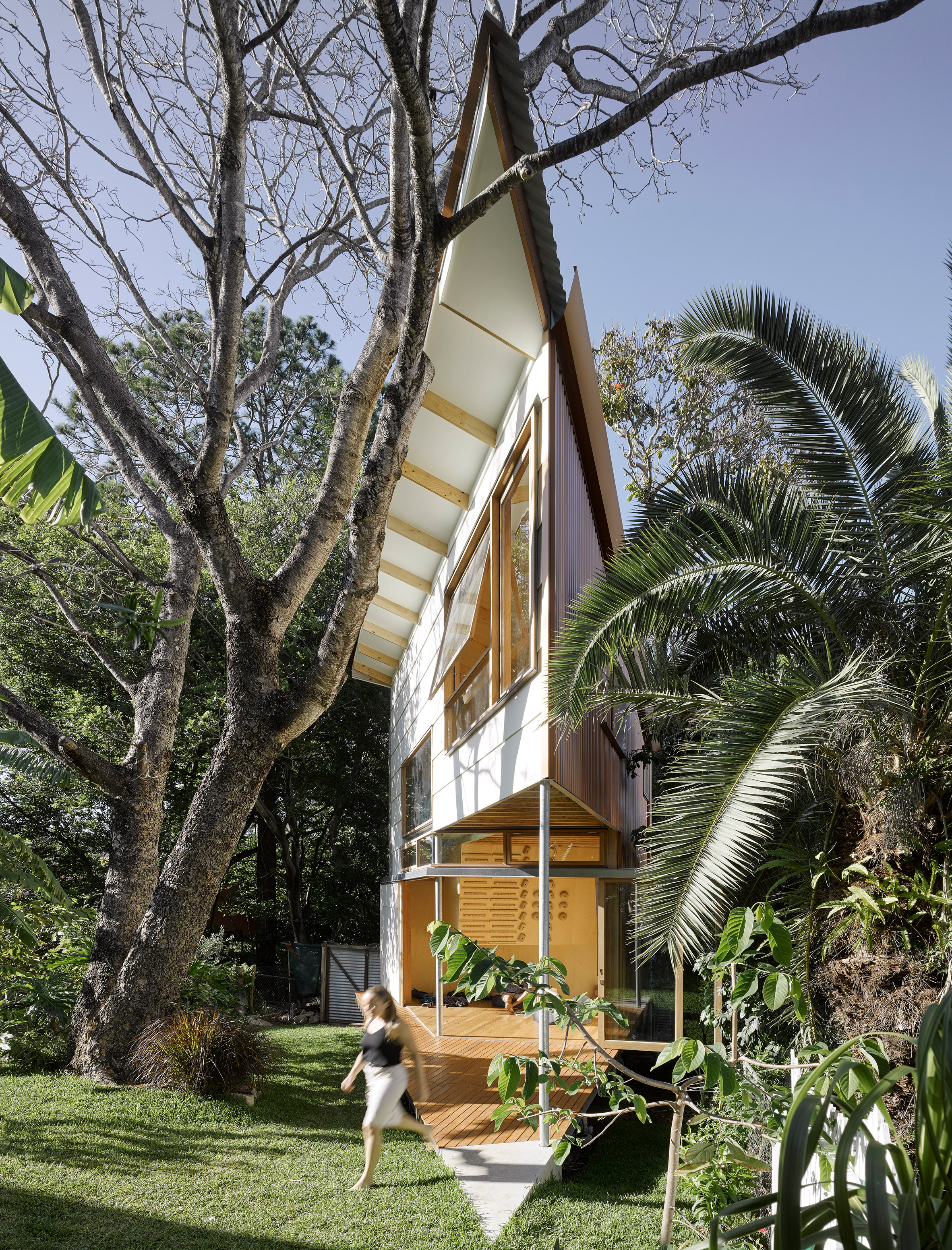 Extremely pointed garden room features a treehouse-like design and a climbing wall