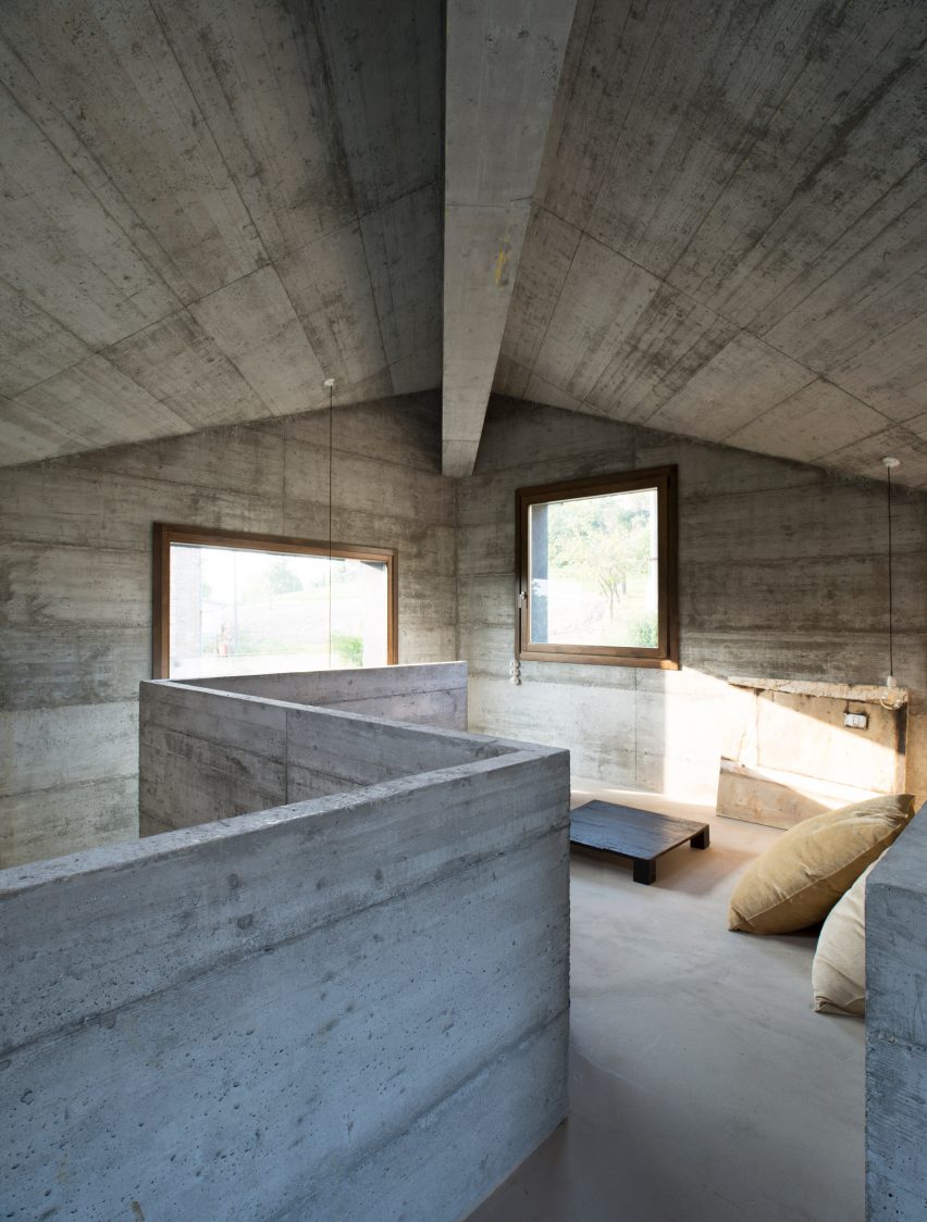 House R by 35a Studio is a concrete holiday home with a twisted roof