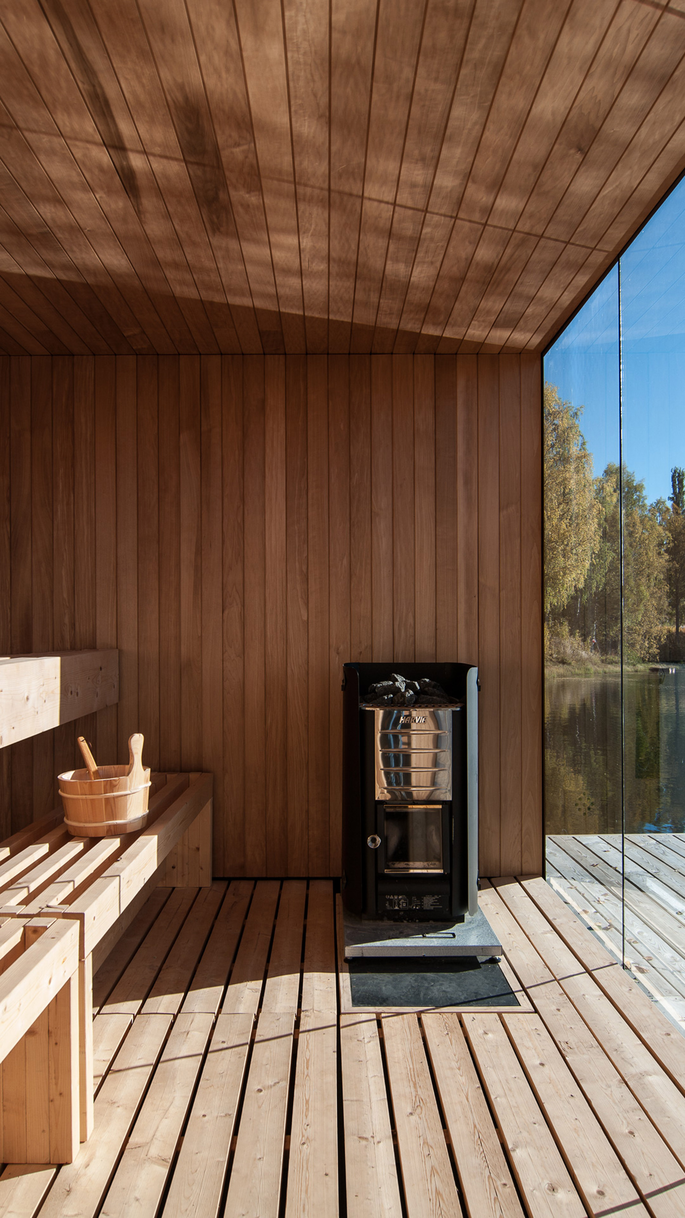 Small Architecture Workshop's charred-wood sauna floats on Swedish lake