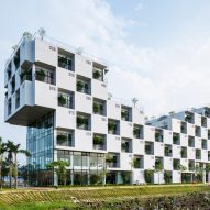 Vo Trong Nghia incorporates trees into chequerboard facade of Hanoi university building