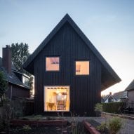 Dutch architect Chris Collaris has completed a house in Amsterdam clad entirely in blackened timber and featuring an asymmetric gabled roof.