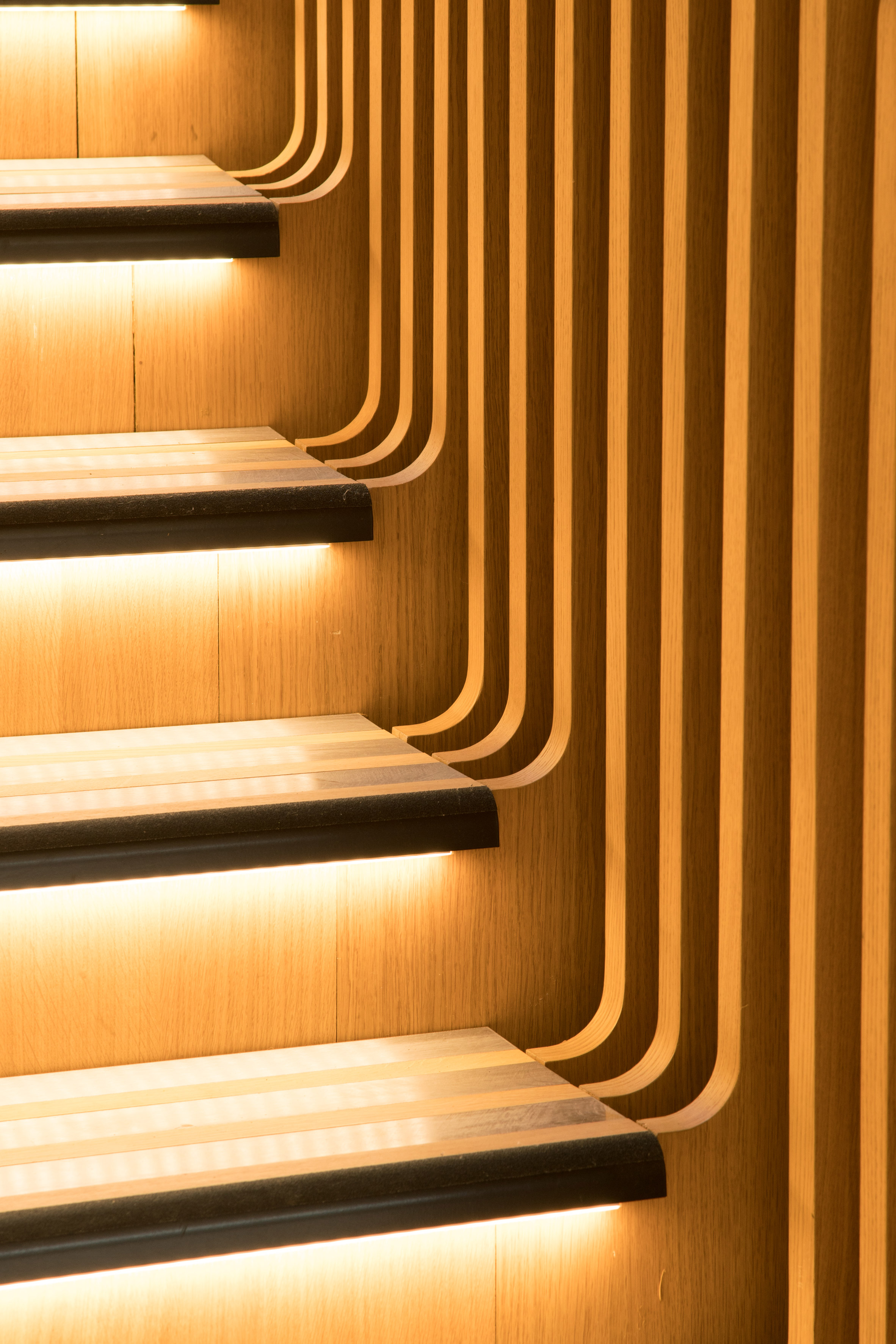 Ora Ïto uses hundreds of wooden slats for snaking stairs at LVMH offices