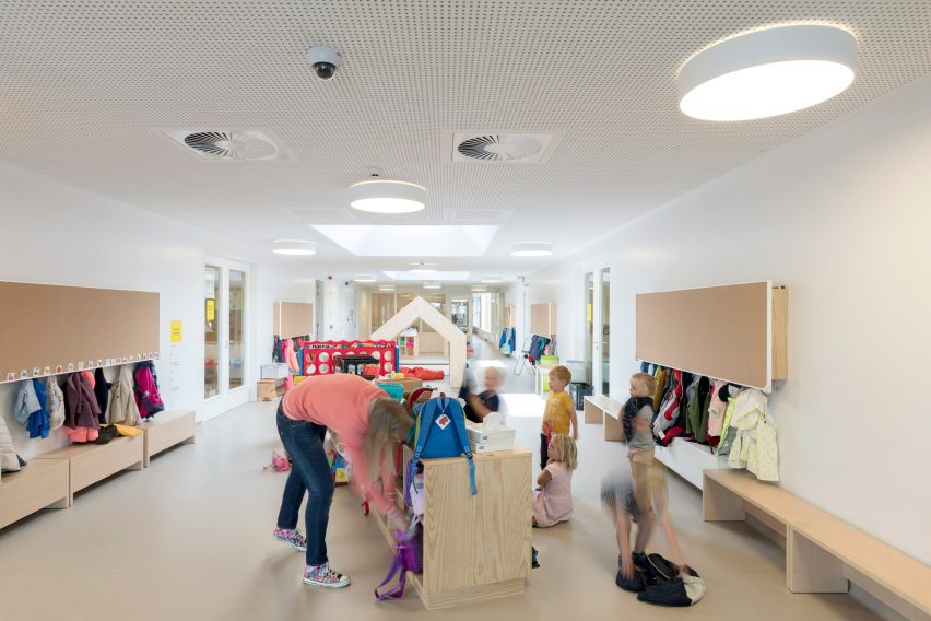 NL Architects completes Belgian school featuring low-lying rooms surrounded by a colonnade