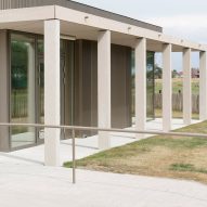 NL Architects completes Belgian school featuring low-lying rooms surrounded by a colonnade