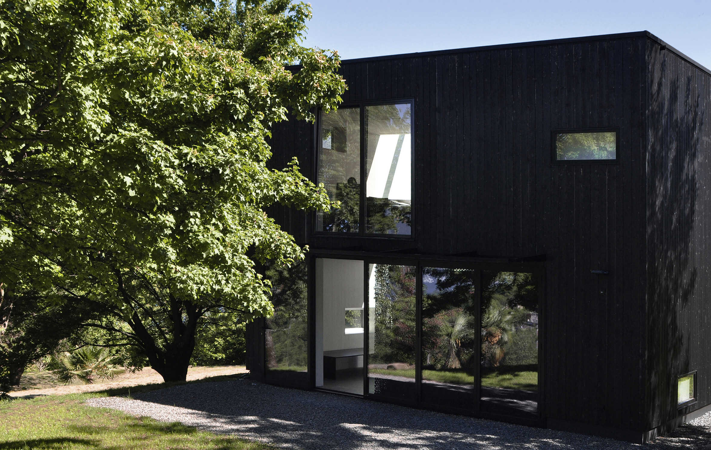 THEWOODBUILDING is a prefabricated wooden holiday home clad in charred timber boards by designers Nicole Lachelle and Christian Niessen