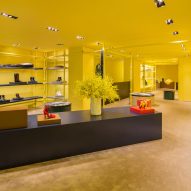 Raf Simons and Sterling Ruby transform Calvin Klein store with yellow scaffolding