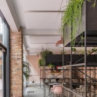 The smooth surface and soft-pink hue of a newly plastered wall provided the starting point for the design of communal spaces at this new creative hub in east London by local studio Sella Concept.