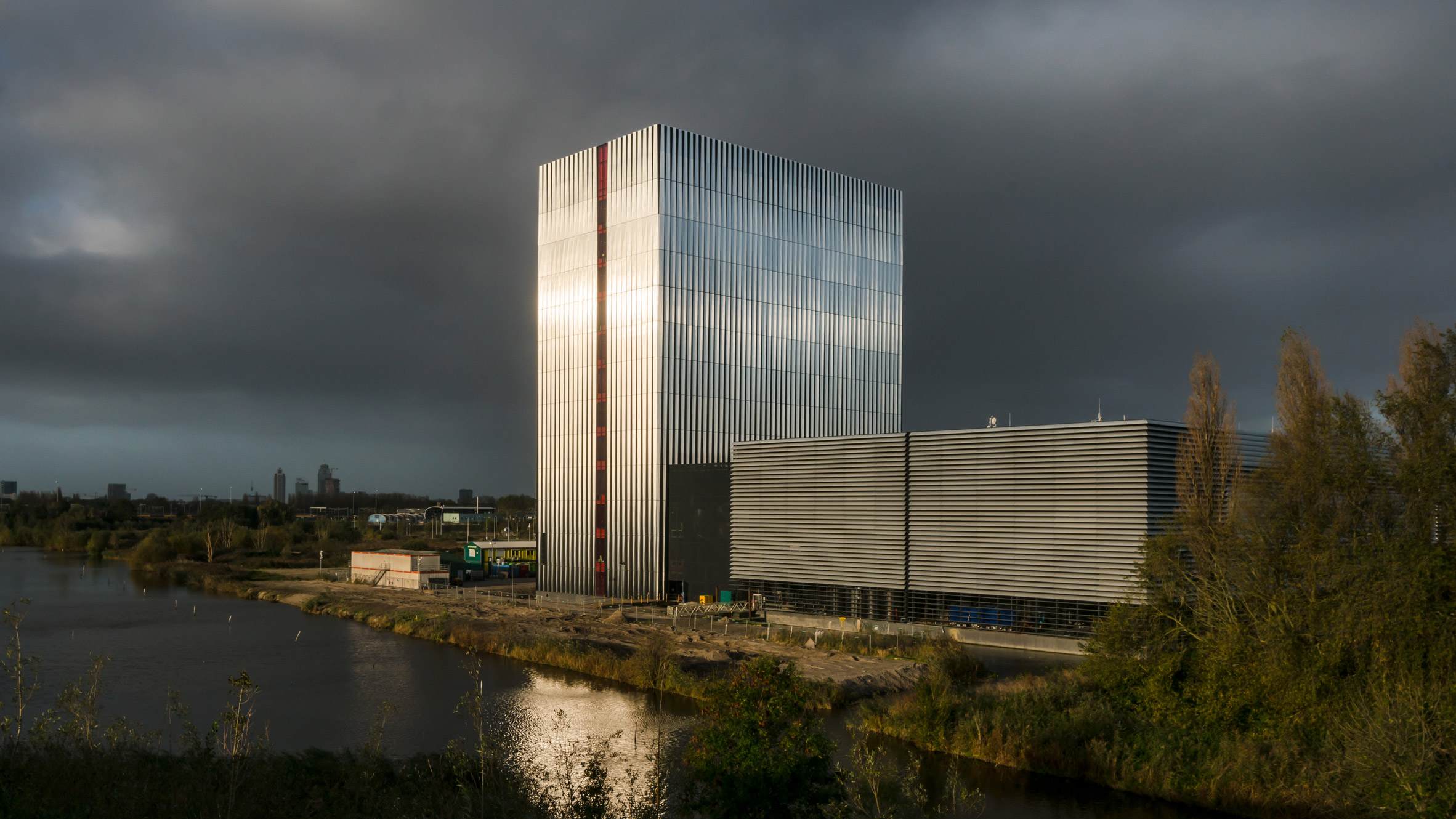 Benthem Crouwel adds stripy tower surrounded by a moat to Amsterdam data centre