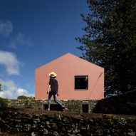 Mezzo Atelier transforms century-old barn into pair of bright pink guesthouses