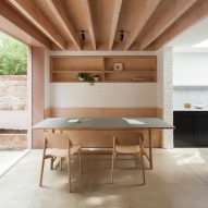 Timber and textured-brick surfaces soften interior of extension by O'Sullivan Skoufoglou Architects