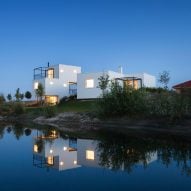 Endorphine connects white boxes with black frames to create homes at Slovakian golf resort