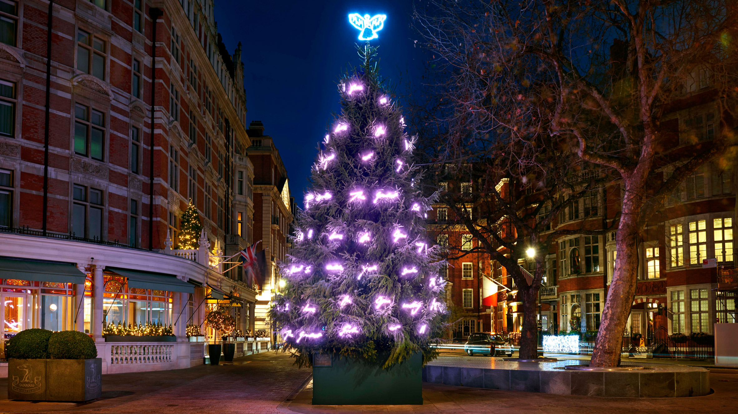 Louis Vuitton stacks travel trunks for Claridge's Christmas tree