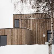 This family home by Danish practice Norm Architects is filled with cosy nooks and opening living areas with generous windows to give views out over picturesque woodland and a lake set around an hour's drive north of Oslo.
