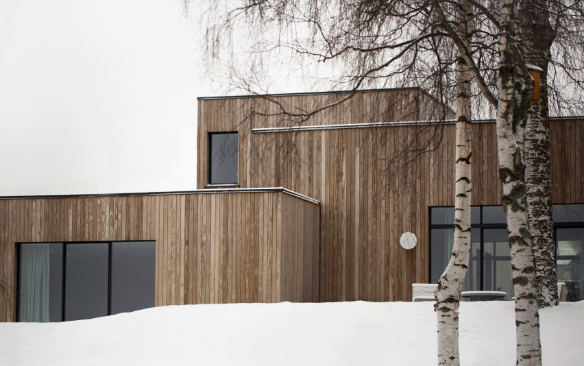This family home by Danish practice Norm Architects is filled with cosy nooks and opening living areas with generous windows to give views out over picturesque woodland and a lake set around an hour's drive north of Oslo.
