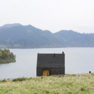 HOLA Design builds gabled lakeside cottage in Poland