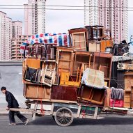 Workers carry exaggerated furniture loads in Alain Delorme's Totems photographs